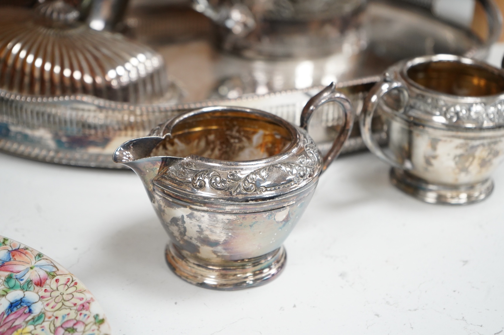 A quantity of plated wares to include a galleried tray, teapot, jug and bon bon dish with glass liner, largest 45cm wide